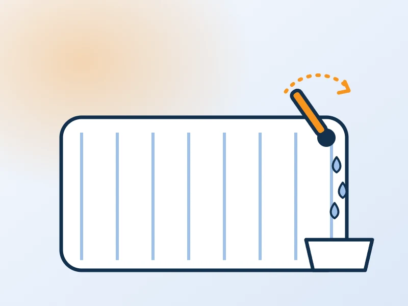 Illustration : purge d’un radiateur avec une clé et un récipient